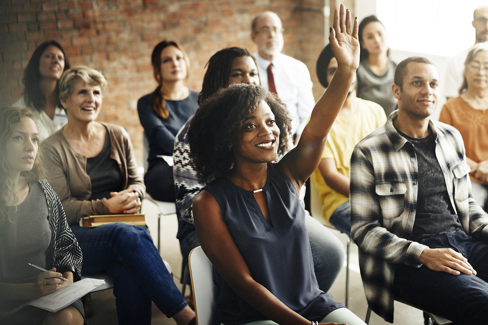 Men and women overcome social anxiety to participate in a training seminar.