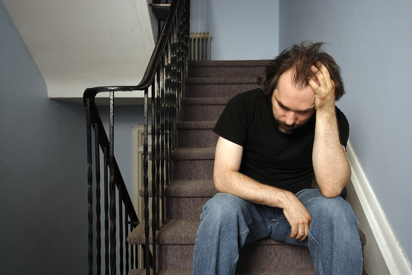 Depressed man on the strairs