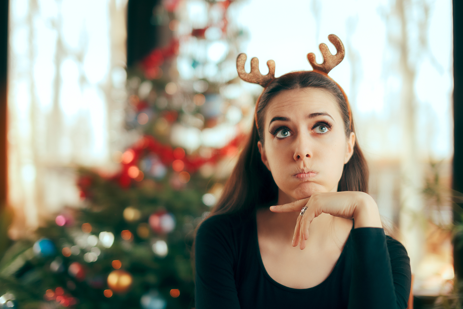 A young woman worries about attending a holiday party.