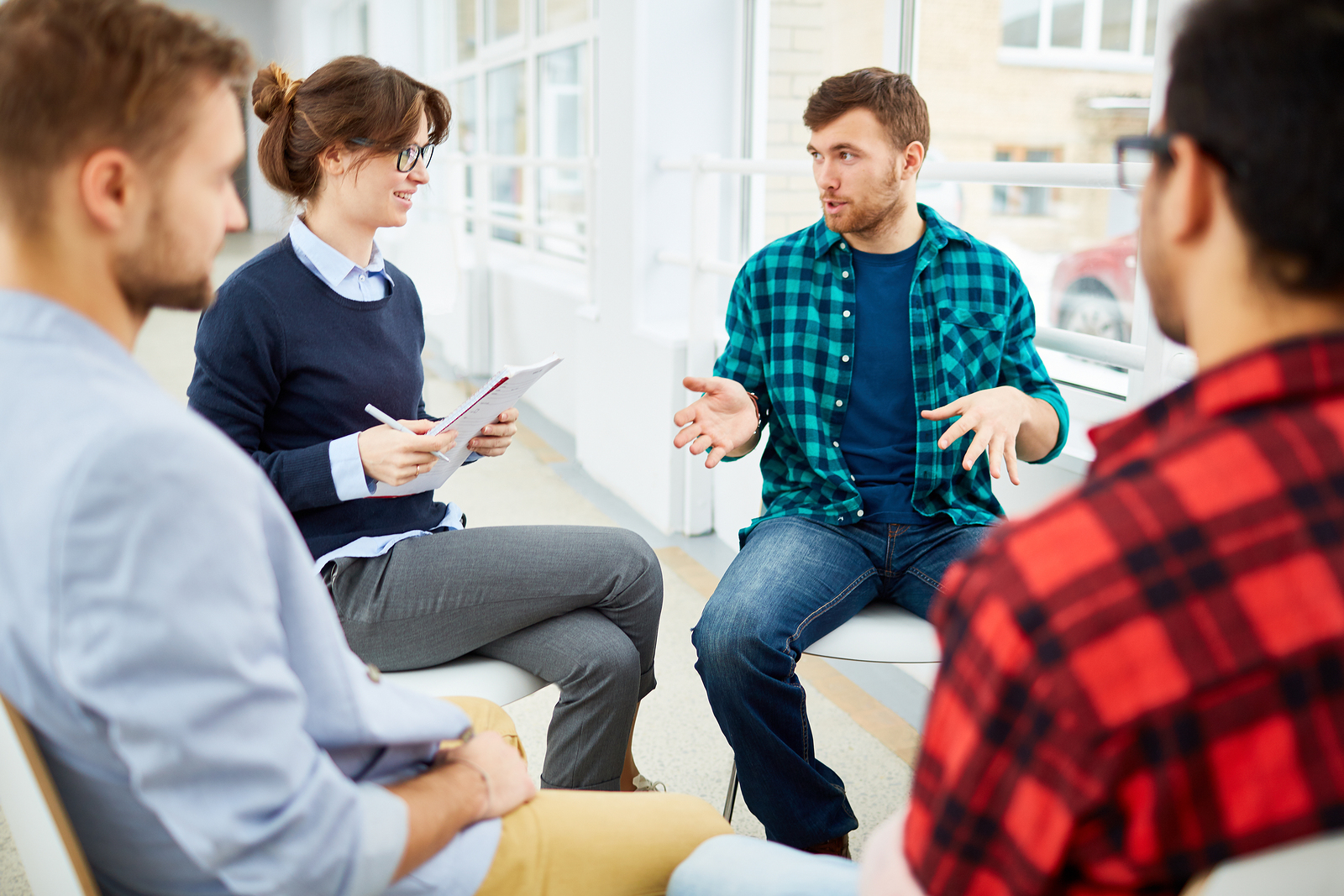 A young man recovers from stimulant addiction during a group therapy session